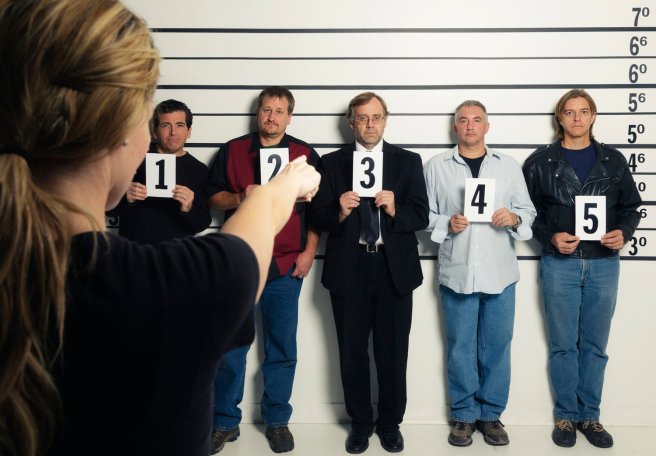 Person Pointing at a Police Lineup
